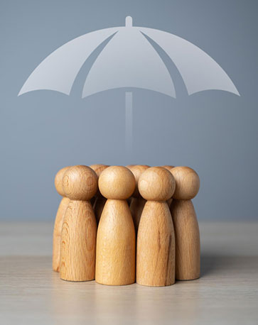 Supplemental & Ancillary Benefits - representation using wooden people under an umbrella